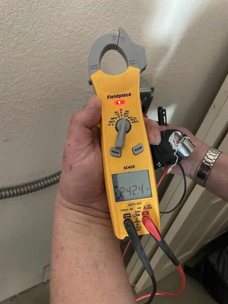 Voltage testing with clamp meter during Electrical Installation Services in Ormond Beach